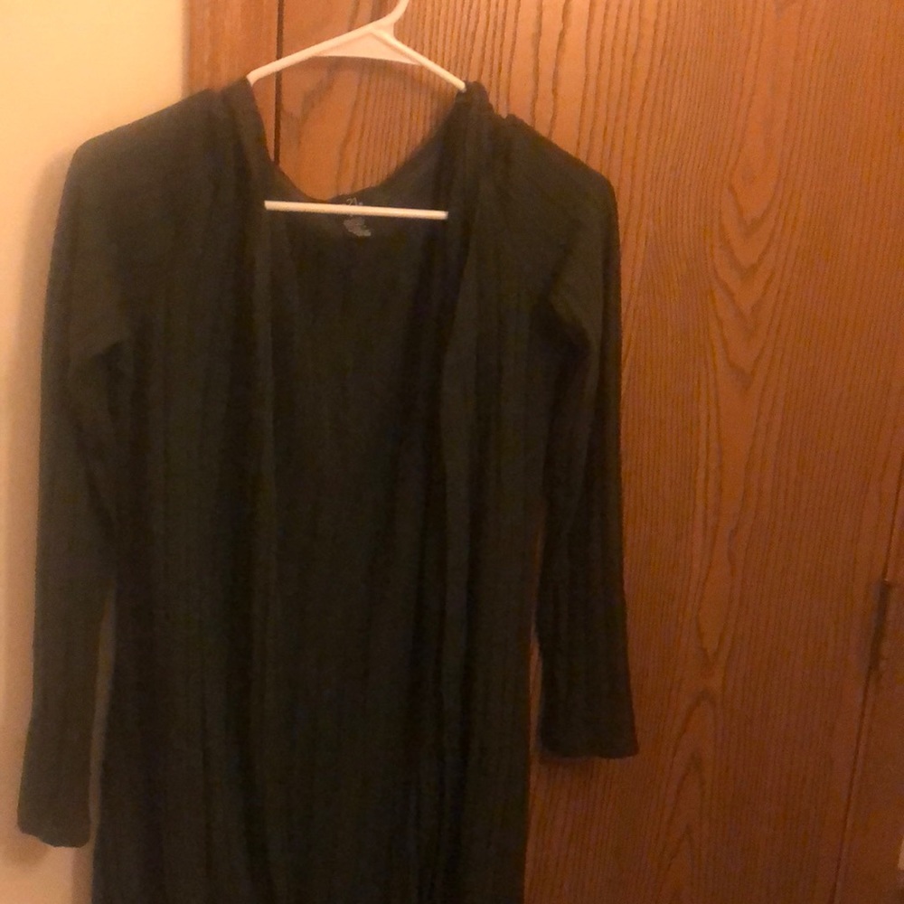 a dark green cardigan